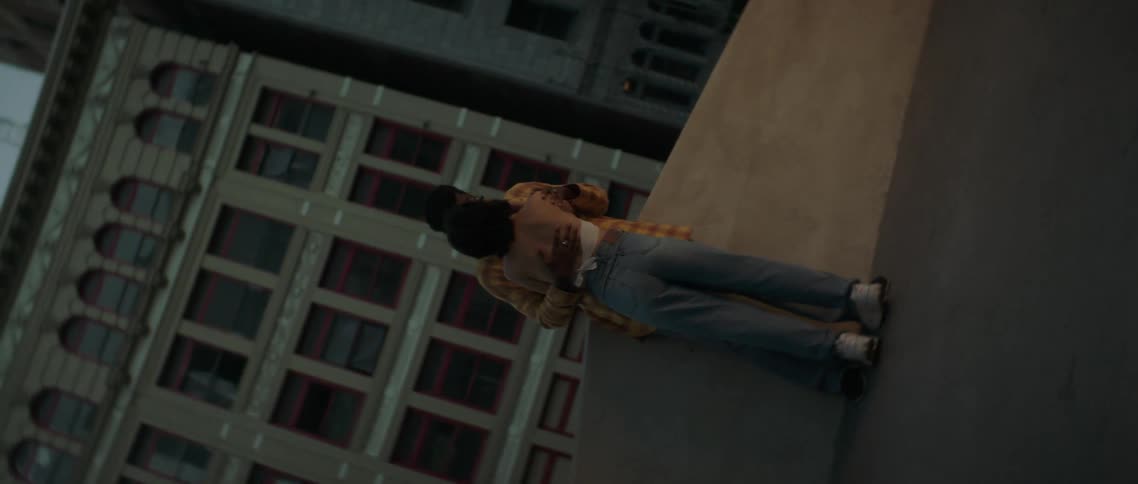 A couple are holding each other on the roof