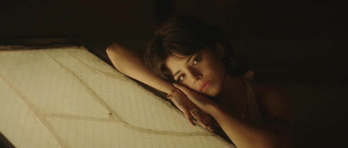 A woman laying on a slanted surface