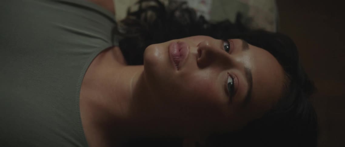 A woman in a room laying on the floor