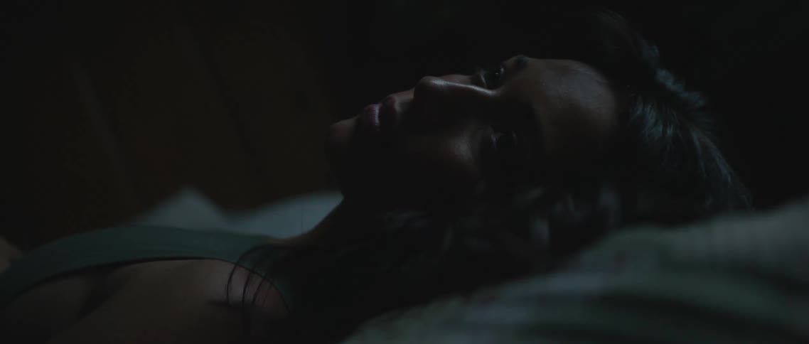 A woman laying in a bed