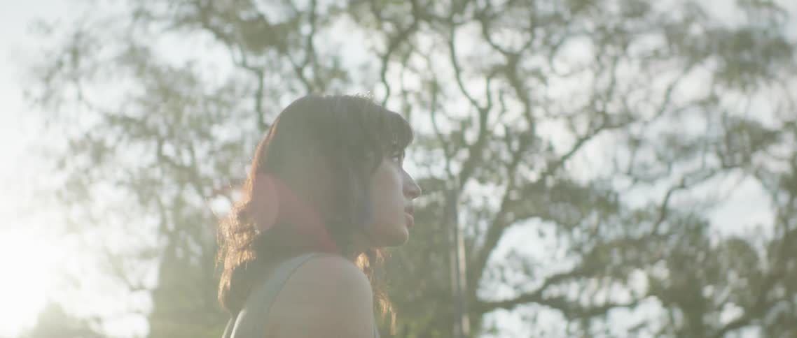 A woman walking around in a neighborhood