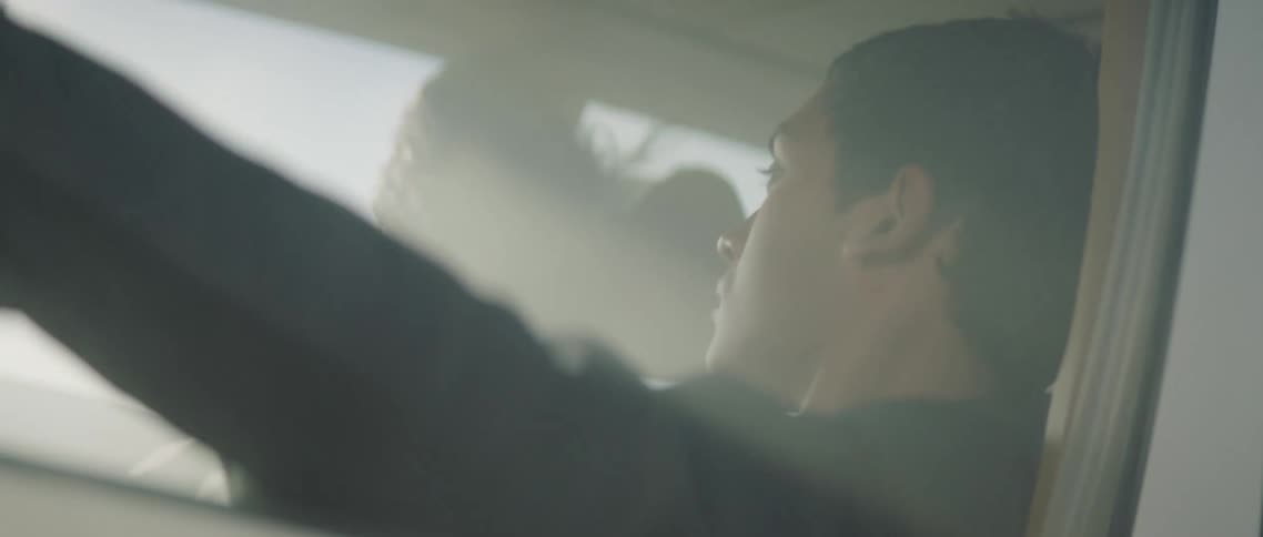 Two people travel in a car filled with fog
