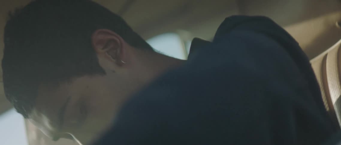 Two people are riding in a vehicle filled with smoke