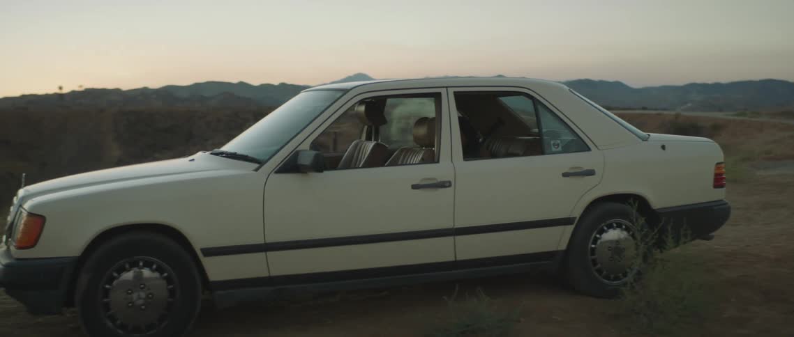 A view of a car sitting out on the road