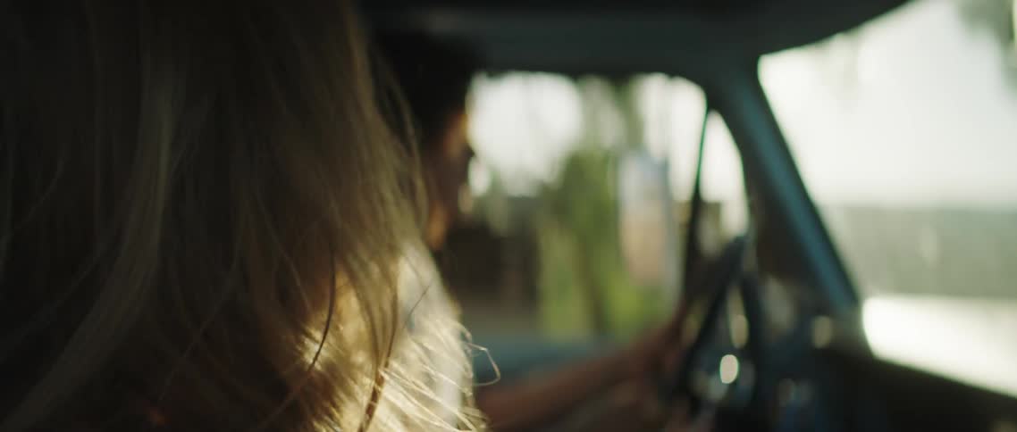 Woman getting in car