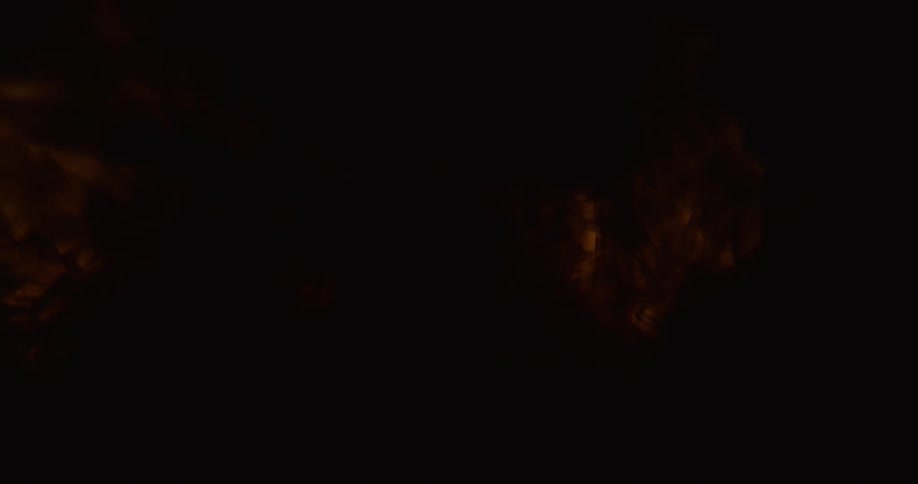 A dark brown liquid expands in murky water