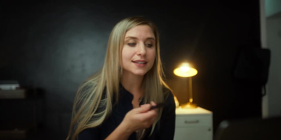 A woman sitting in a room talking