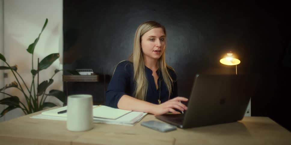 Person talking to laptop