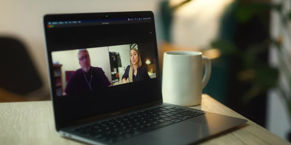 A woman using a laptop to do video calls