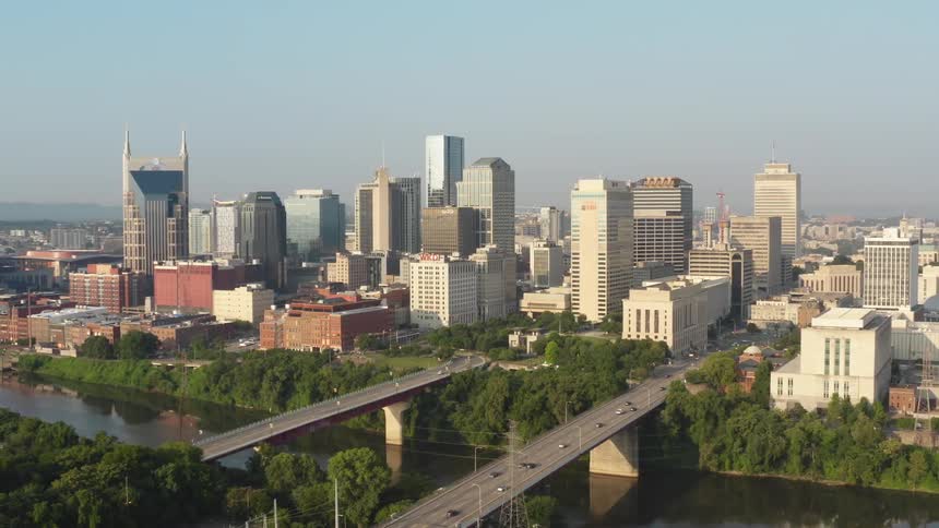 A large city sprawls alongside a wide river