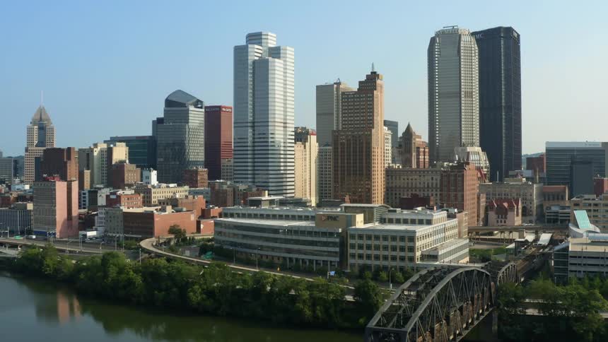 An aerial view of tall skyscrapers and buildings in a city