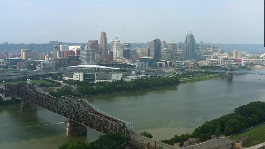 Aerial view of bridges over river and high rise city buildings