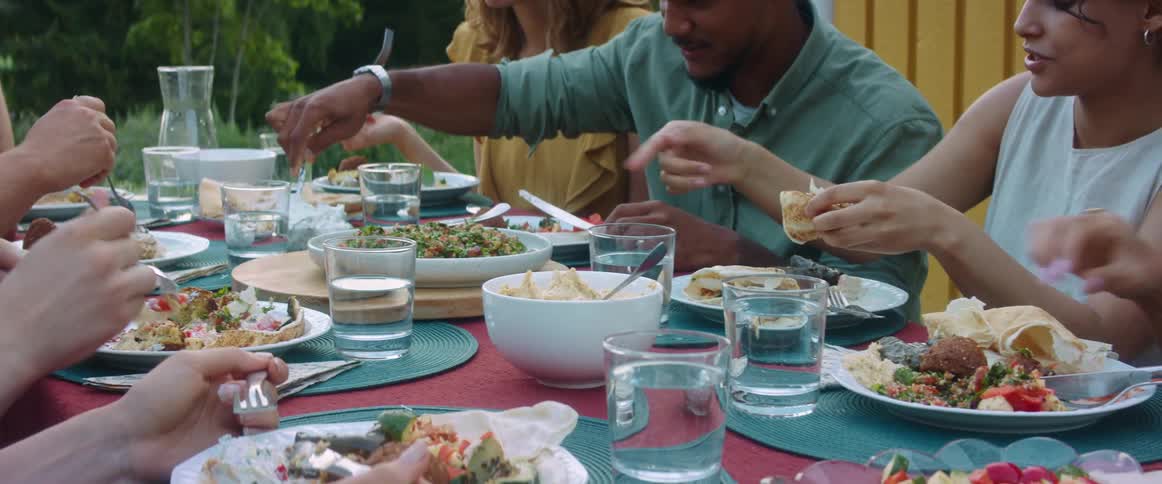 A group of people eating outside