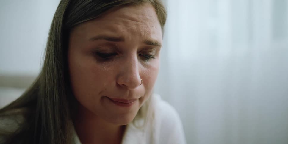 A woman is crying in the room