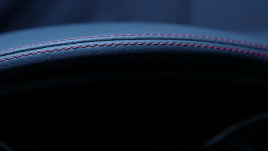 A close up view of a cushion on a car seat is displayed
