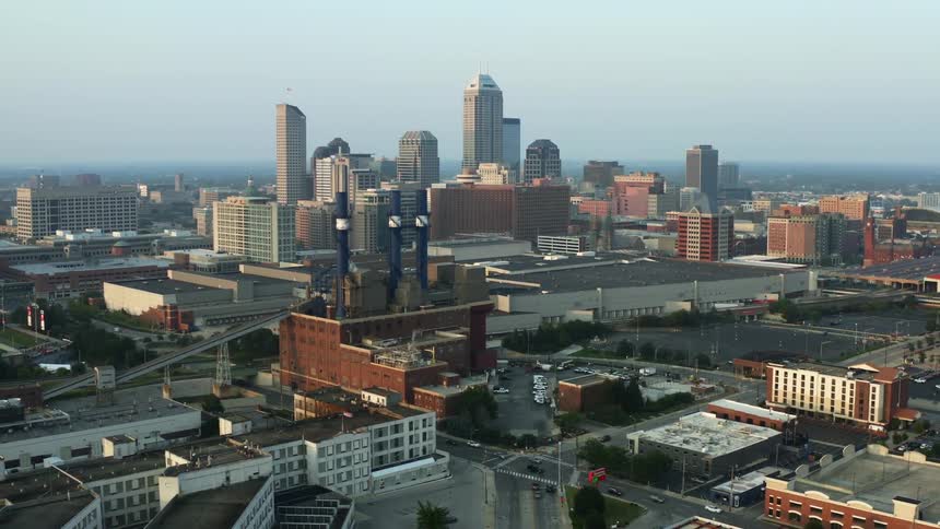 Traffic moving among buildings and skyscrapers in a city