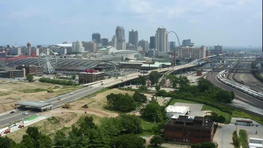 An aerial view of a city with tall buildings