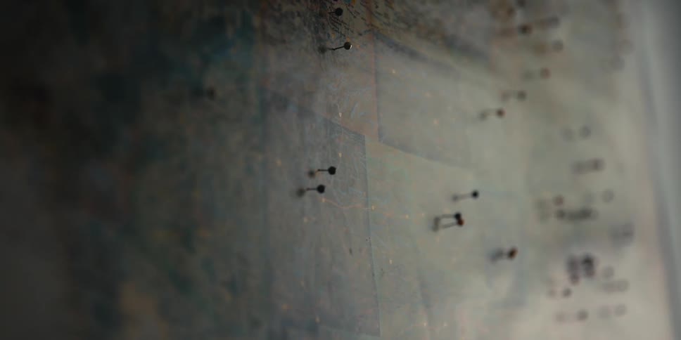 Pushpins covering a map