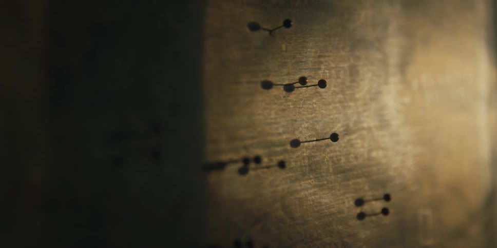 Pins stuck in a wooden board