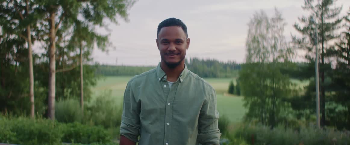 A portrait of a man standing outdoors