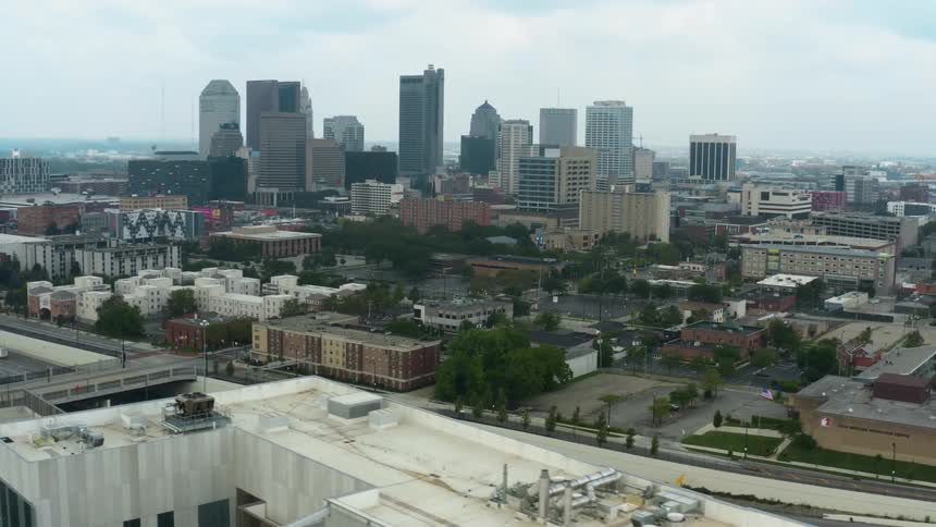Aerial view of high rise buildings with vehicles driving on highways