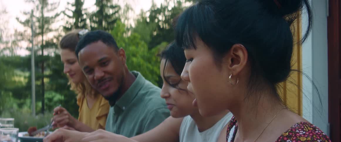 A group of people eating at a gathering