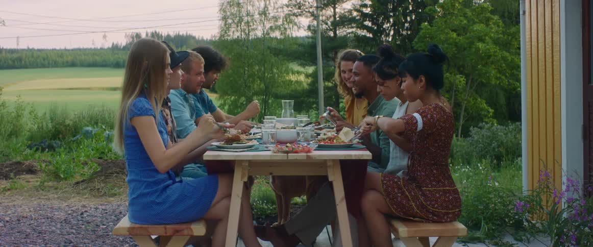 A group of people eating food together