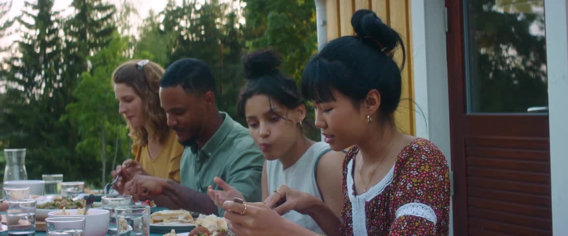 People are eating together outside