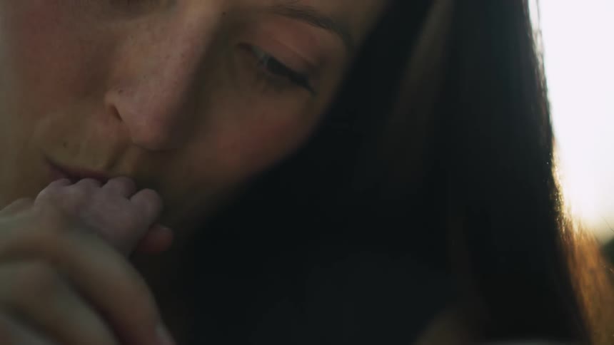 Person kissing baby