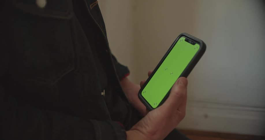 A person is holding a phone with the screen on