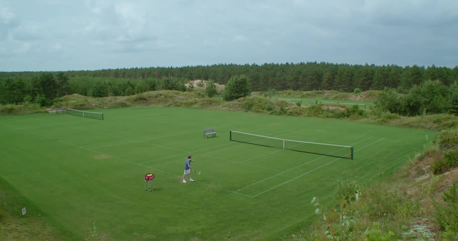 A man hitting a tennis ball outdoors