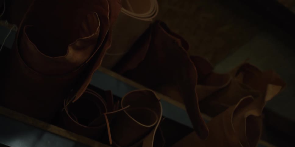 Rolled up leather on a shelf
