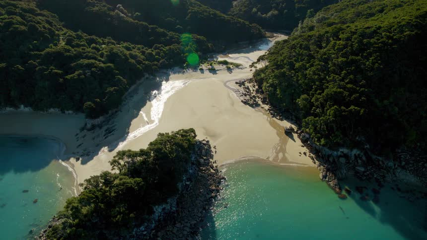 Aerial view of an ocean near the coast is displayed in spring