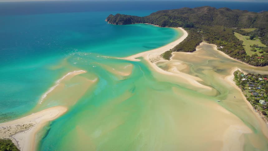 White sand beaches and turquoise ocean water shimmering in the sunlight