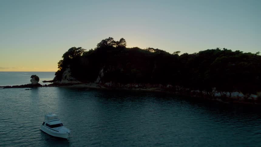 A boat is near the coast of the island