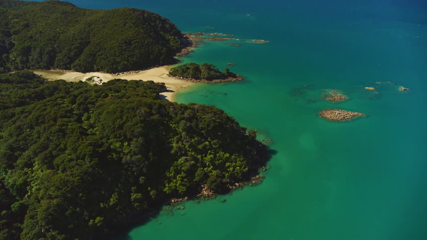 The water is blue near the coast of the island