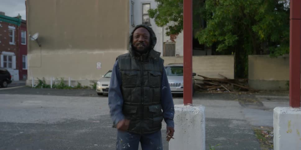 African american man is smiling and giving a thumbs up
