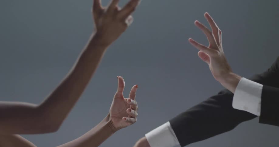Man and woman move their arms gesturing and reaching for each other