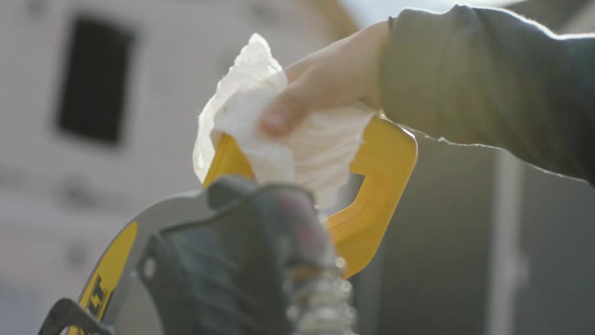 A person is washing the table saw