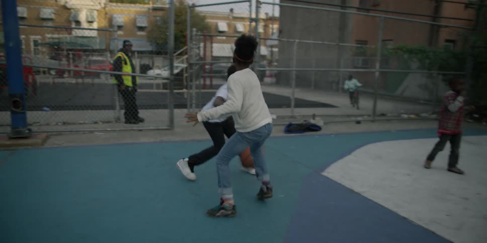 A group of kids playing basketball