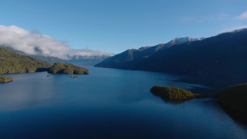 The river water is blue by the mountains