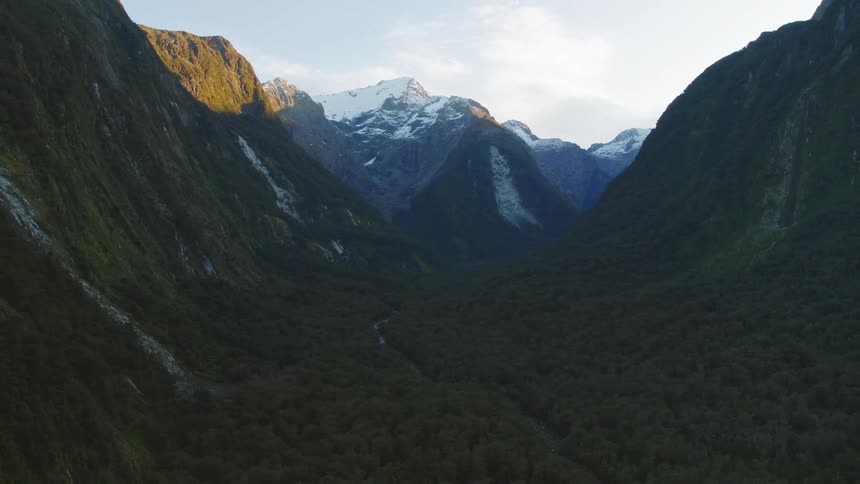 Aerial view of mountains is displayed at dusk