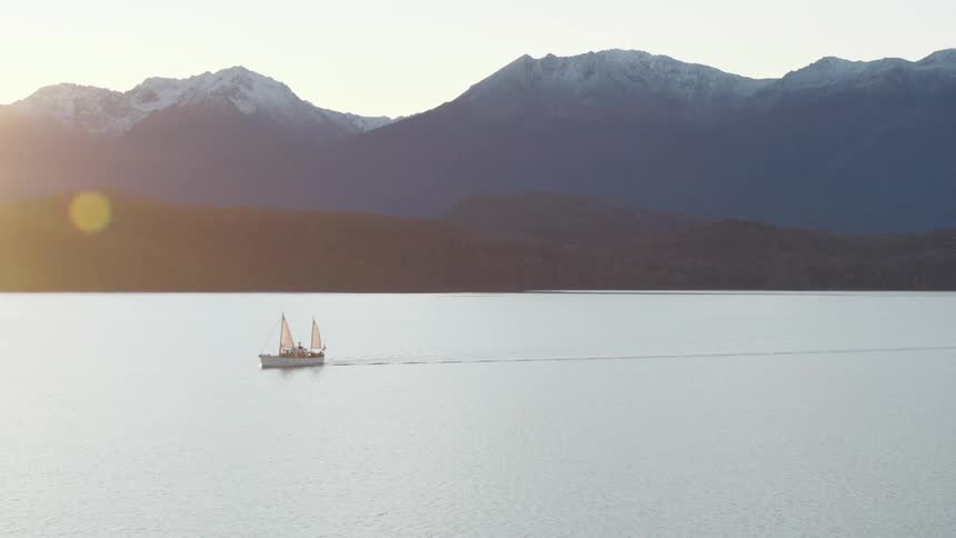 An aerial view of a boat on a lake