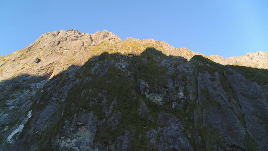 Mountains with peaks high in a clear blue sky