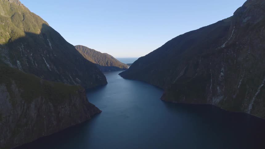 Aerial view of a river valley between two mountains