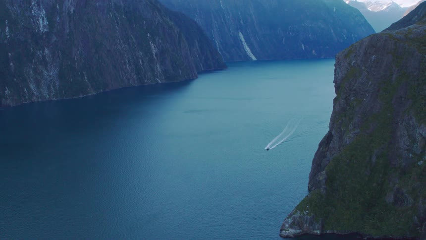 An aerial view of a boat in a canyon