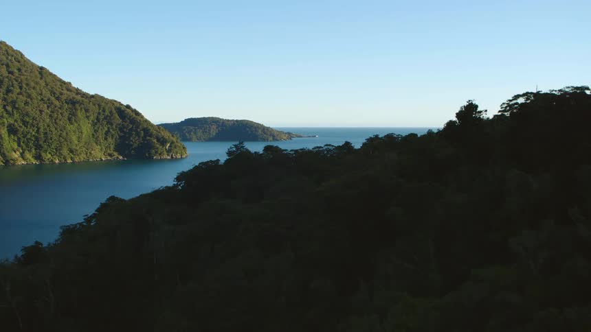 An aerial view of the ocean and cliffs next to it