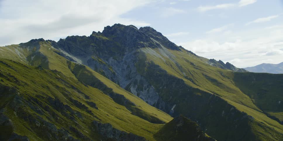 A mountain ridge with the sky in the background