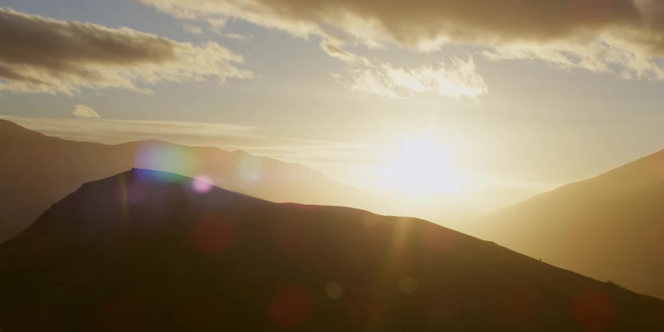Aerial view of high mountains range at dawn