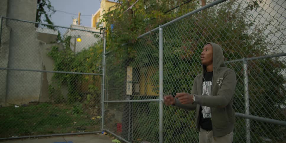 A man dribbles a basketball and shoots